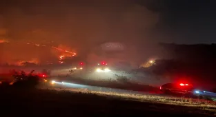 Balıkesir'de otluk ve makilik alanda çıkan yangın kontrol altına alındı